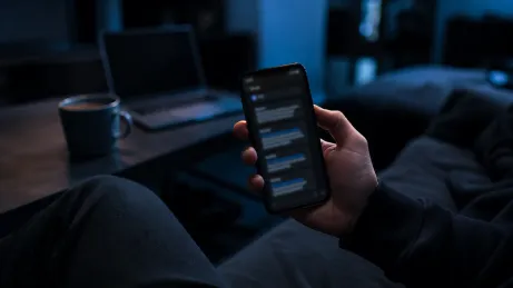 A user interacting with Telegram on a smartphone, exploring the Hidden Wiki.